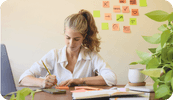 A female therapist works on her time management at her desk