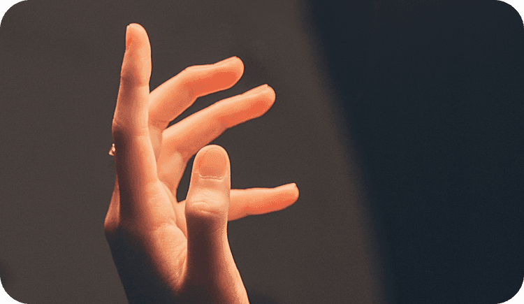 A hand of someone experiencing somatic therapy