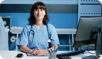 A female psychiatrist or psychiatric mental health nurse practitioner (PMHNP) prepares to use ePrescribe to prescribe a medication to her patient