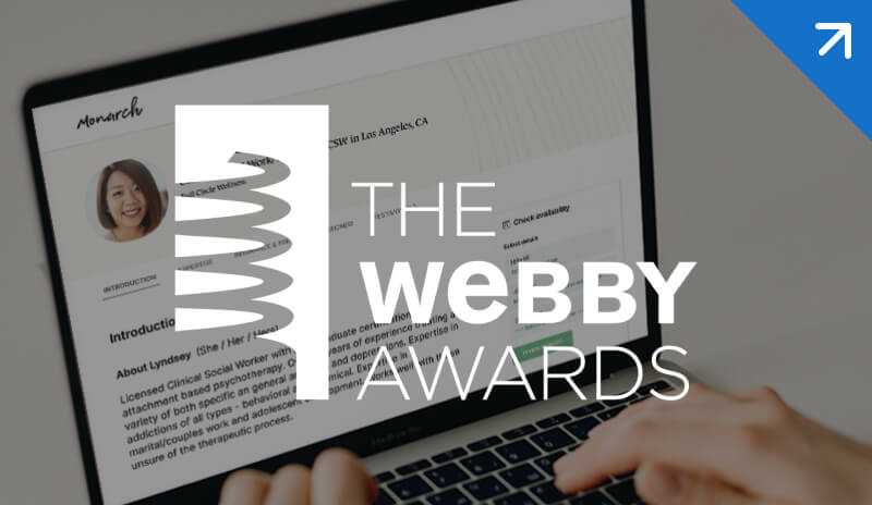 Photo of clinician using SimplePractice on their laptop with The Webby Awards logo overlaid