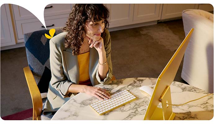 A female therapist types on her computer keyboard as she accesses her AI for therapists session notes