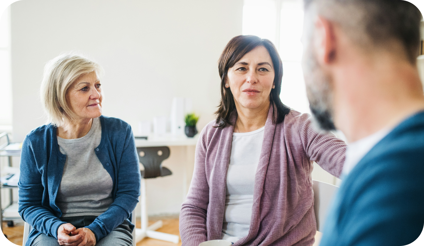 A female therapist discusses systemic family therapy with her clients